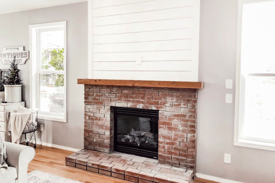Brick Fireplace Hearth With a Shiplap Accent Wall
